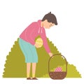 Brunette boy on Easter egg hunt in garden. Searching for colorful eggs in a park. Boy play outdoors. Character on white background Royalty Free Stock Photo