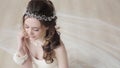 Brunette bride in fashion white wedding dress with makeup