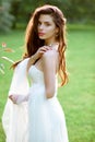 Brunette bride in fashion white wedding dress with makeup Royalty Free Stock Photo