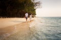 brunette bride and groom walk barefoot Royalty Free Stock Photo