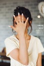 Brunette bride showing hand with wedding ring and hiding face. Royalty Free Stock Photo