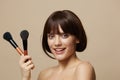 brunette brushe cosmetics attractive look posing cropped view Royalty Free Stock Photo