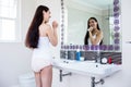 Brunette brushing teeth