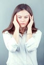 Brunette business woman headache touch head with finger Royalty Free Stock Photo