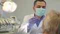 Dentist begins check up of female patient