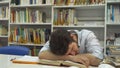 Guy sleeps at the library