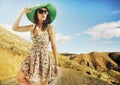 Brunette cutie with huge sunglasses and green hat