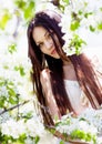 Brunette girl in blossom garden Royalty Free Stock Photo