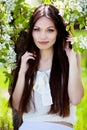 Brunette girl in blossom garden Royalty Free Stock Photo