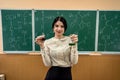 brunette girl conducts a master class in chemistry with flasks in a chemical office. Royalty Free Stock Photo