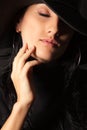 Brunette girl in the hat gently touch your face Royalty Free Stock Photo
