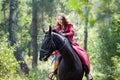 Brunette girl on horse Royalty Free Stock Photo