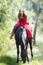 Brunette girl on horse Royalty Free Stock Photo