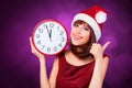 Brunette girl with huge clock Royalty Free Stock Photo