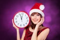 Brunette girl with huge clock Royalty Free Stock Photo