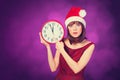 Brunette girl with huge clock Royalty Free Stock Photo