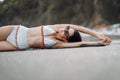 Girl in a stylish swimsuit have a rest n a beach Royalty Free Stock Photo