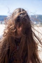 Brunette girl with long hair flying in the wind Royalty Free Stock Photo