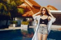 Brunette girl relaxing at the pool Royalty Free Stock Photo