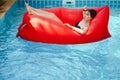 Brunette girl relaxing in the pool Royalty Free Stock Photo