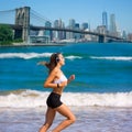 Brunette girl running in New York Brooklyn bridge Royalty Free Stock Photo