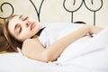 Brunette girl sleeping in bed Royalty Free Stock Photo