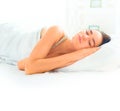 Brunette girl sleeping in her comfortable bed Royalty Free Stock Photo