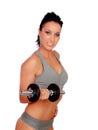 Brunette girl stimulating their fitness with dumbbells