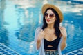 Brunette girl relaxing at the pool Royalty Free Stock Photo