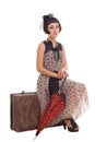 Brunette girl with umbrella and suitcase Royalty Free Stock Photo