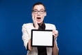 Brunette with glasses and a tablet in hands Royalty Free Stock Photo