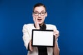 Brunette with glasses and a tablet in hands Royalty Free Stock Photo