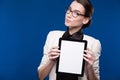 Brunette in glasses with a tablet in hands Royalty Free Stock Photo