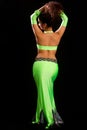 Brunette in a green suit oriental dance Royalty Free Stock Photo