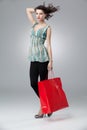 Brunette holding shopping bag Royalty Free Stock Photo