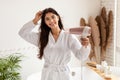 Brunette Lady Posing With Blowdryer Drying Hair In Modern Bathroom Royalty Free Stock Photo