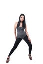 Brunette lady wear black leggings, leotard and wedge sandals Royalty Free Stock Photo