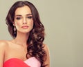 Brunette with long curled hair. Royalty Free Stock Photo