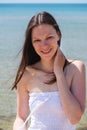 Brunette with long hair portrait. The sea in the background. Royalty Free Stock Photo