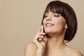 brunette makeup lipstick in hand model posing close-up Lifestyle Royalty Free Stock Photo