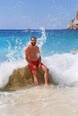 Brunette man at Erimitis beach Paxos island Greece