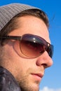 Brunette Man With Sunglasses And A Hat Looking Royalty Free Stock Photo