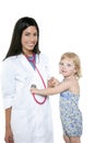 Brunette pediatric doctor with blond little girl