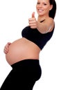 Brunette pregnant woman saying Ok Royalty Free Stock Photo