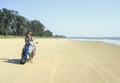 Brunette rides on a deserted beach along the ocean at mot Royalty Free Stock Photo