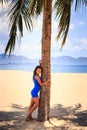 brunette slim girl in short blue frock barefoot