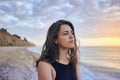 Brunette tanned girl in swimwear enjoying and walking on beach Royalty Free Stock Photo