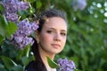 Brunette teen girl and lilac Royalty Free Stock Photo