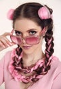 Brunette teen girl with two french braids from pink kanekalon, f Royalty Free Stock Photo