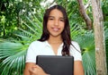 Brunette teen student indian latin holding laptop